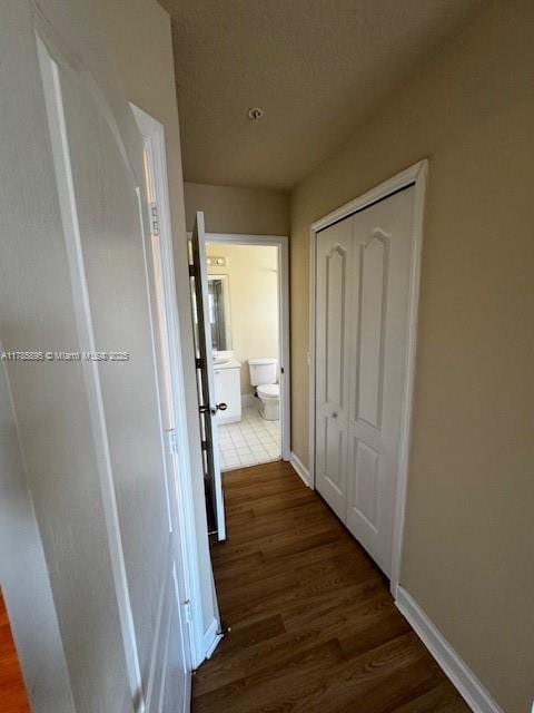 1017 Shoma Dr Unit 462, Royal Palm Beach, FL 33414 - hall featuring dark wood finished floors and baseboards