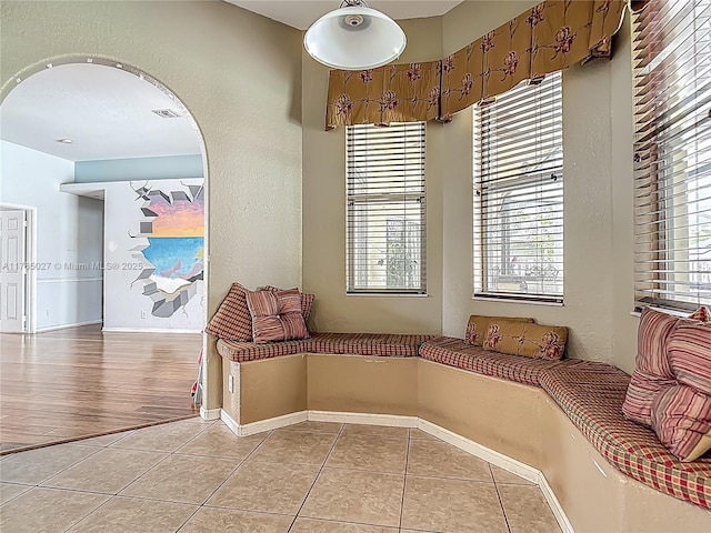375 SW Dustin Ave, Port St Lucie, FL 34953 - unfurnished room featuring a healthy amount of sunlight, baseboards, light tile patterned flooring, and visible vents