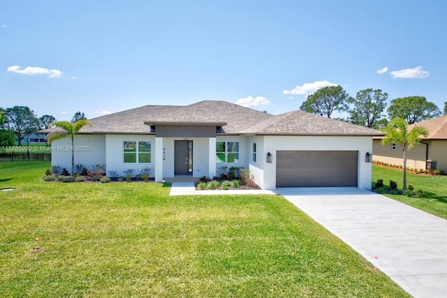 ranch-style house featuring an attached garage, a front yard, and stucco siding
