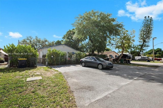 exterior space with fence and driveway