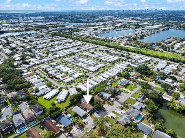 aerial view featuring a residential view and a water view