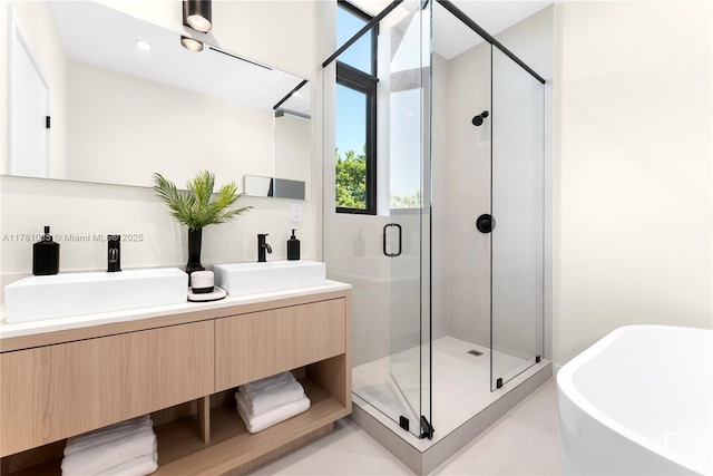 2501 SW 27th St Unit 4, Miami, FL 33133 - bathroom featuring a soaking tub, a stall shower, and a sink