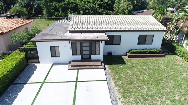771 E 35th St, Hialeah, FL 33013 - view of front of house featuring stucco siding and a tile roof