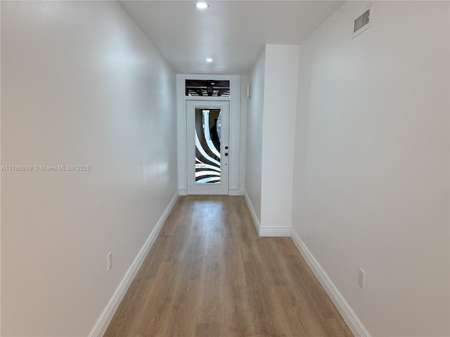 16528 Bridge End Rd, Miami Lakes, FL 33014 - hallway featuring recessed lighting, light wood-type flooring, visible vents, and baseboards