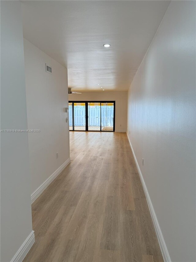 16528 Bridge End Rd, Miami Lakes, FL 33014 - corridor with light wood finished floors and recessed lighting