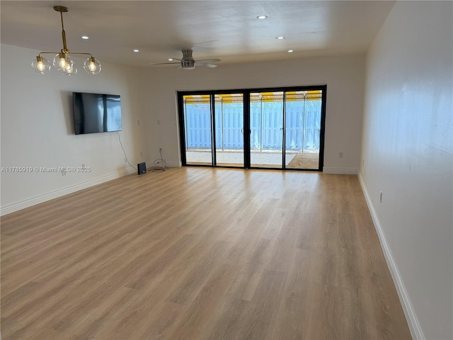 16528 Bridge End Rd, Miami Lakes, FL 33014 - unfurnished living room featuring light wood-style flooring, ceiling fan, and recessed lighting