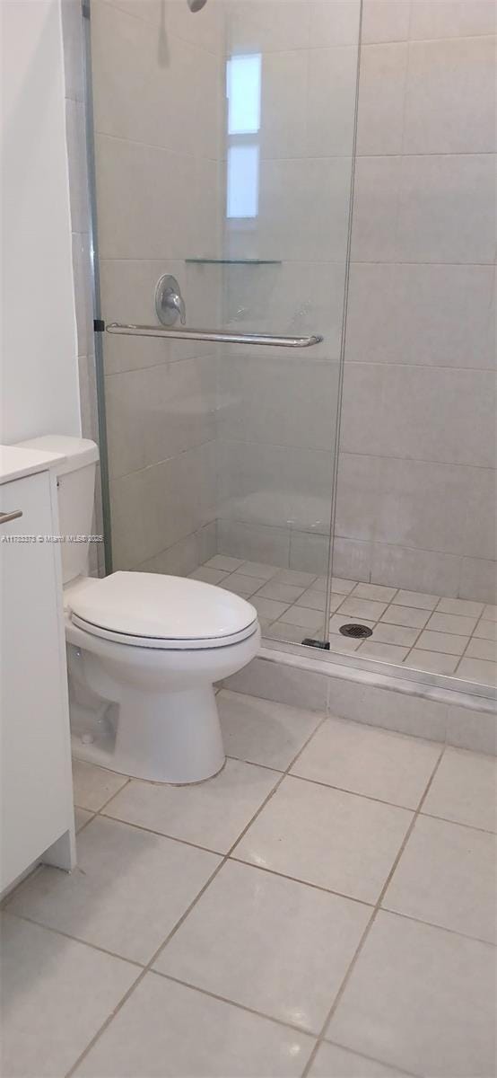 12121 NW 23rd Ct Unit 12121, Miami, FL 33167 - full bath featuring a stall shower, tile patterned floors, and vanity
