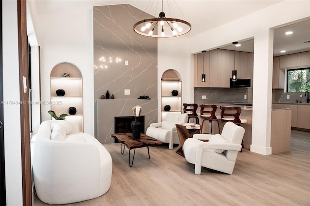 751 NE 80th St, Miami, FL 33138 - interior space featuring built in shelves, recessed lighting, a chandelier, and light wood-style flooring