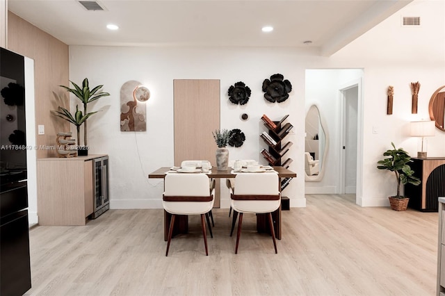 751 NE 80th St, Miami, FL 33138 - dining area with visible vents, light wood finished floors, and wine cooler