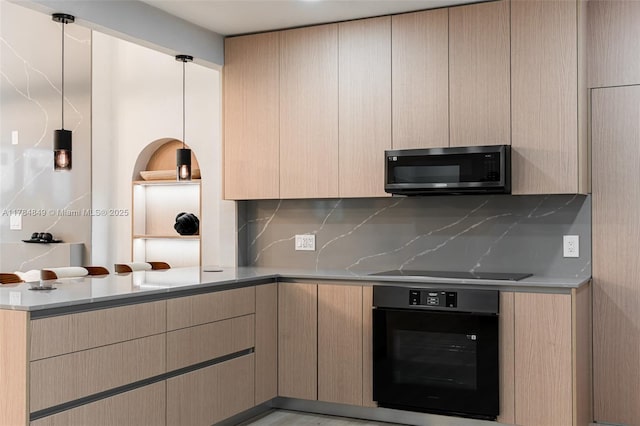 751 NE 80th St, Miami, FL 33138 - kitchen featuring light countertops, light brown cabinets, decorative backsplash, black appliances, and a peninsula