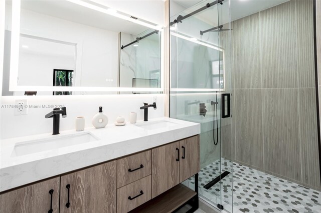 751 NE 80th St, Miami, FL 33138 - full bath with a sink, double vanity, and a stall shower