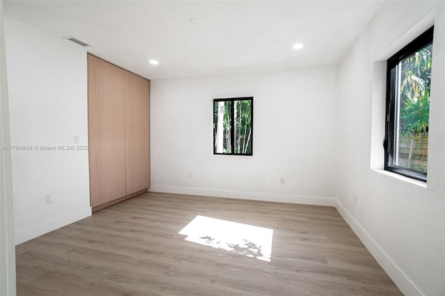 751 NE 80th St, Miami, FL 33138 - empty room with baseboards, visible vents, recessed lighting, and light wood-style floors