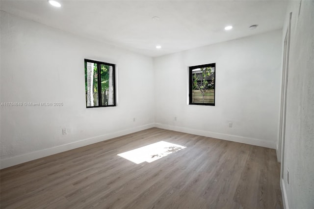 751 NE 80th St, Miami, FL 33138 - empty room with baseboards, wood finished floors, and recessed lighting
