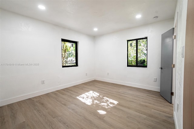 751 NE 80th St, Miami, FL 33138 - spare room with baseboards, wood finished floors, and recessed lighting