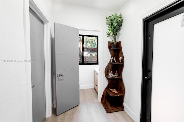 751 NE 80th St, Miami, FL 33138 - corridor with light wood finished floors and baseboards