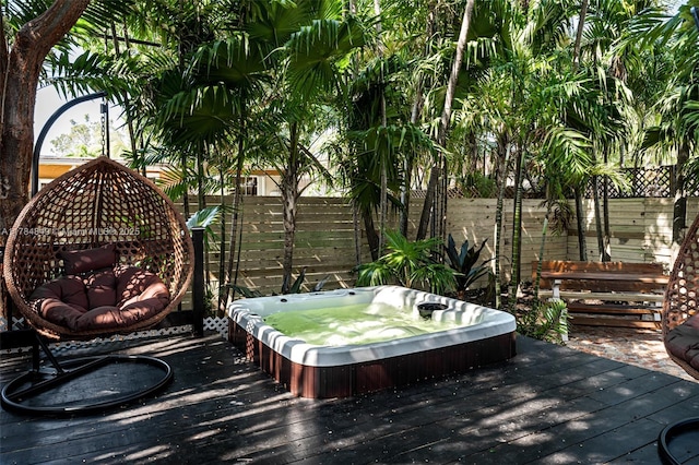 751 NE 80th St, Miami, FL 33138 - deck featuring a fenced backyard and hot tub deck surround