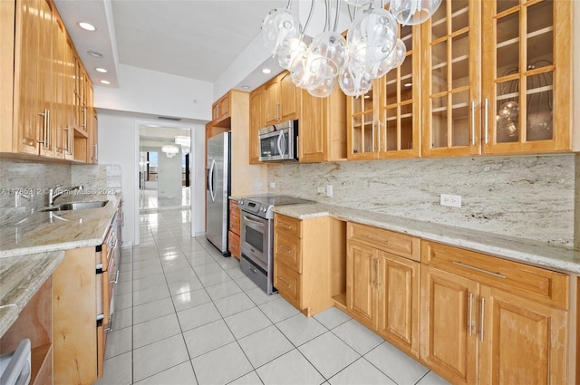 20191 E Country Club Dr Unit Ts3, Aventura, FL 33180 - kitchen featuring stainless steel appliances, a sink, light tile patterned flooring, glass insert cabinets, and decorative backsplash