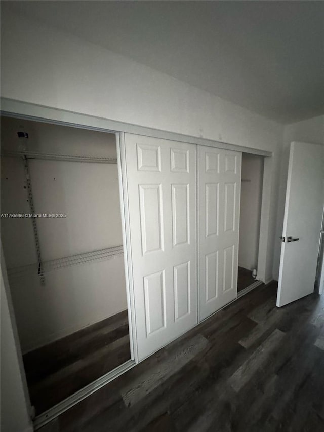 22 Suffolk A 22, Boca Raton, FL 33434 - unfurnished bedroom with wood finished floors and a closet