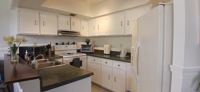 8255 SW 152nd Ave Unit E-410, Miami, FL 33193 - kitchen featuring dark countertops, a sink, under cabinet range hood, and white appliances