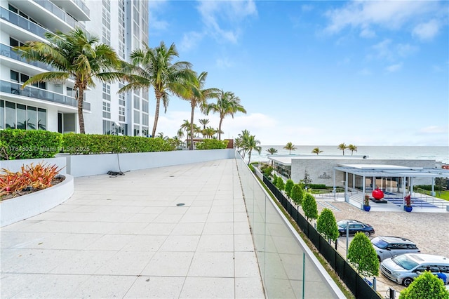 surrounding community with a water view
