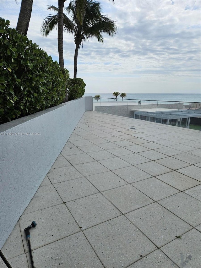 view of swimming pool with a water view