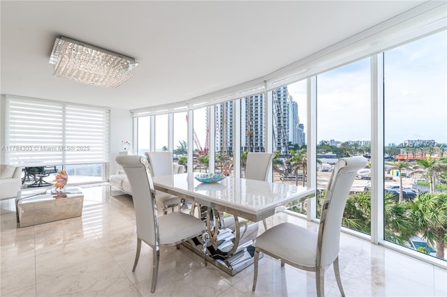 sunroom / solarium featuring a city view
