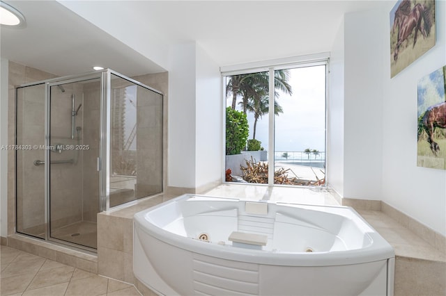 18911 Collins Ave Unit 405, Sunny Isles Beach, FL 33160 - full bathroom with a shower stall, a jetted tub, and tile patterned floors