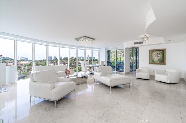interior space with visible vents, floor to ceiling windows, and marble finish floor