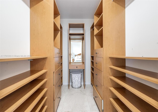 18911 Collins Ave Unit 405, Sunny Isles Beach, FL 33160 - walk in closet with light marble finish flooring