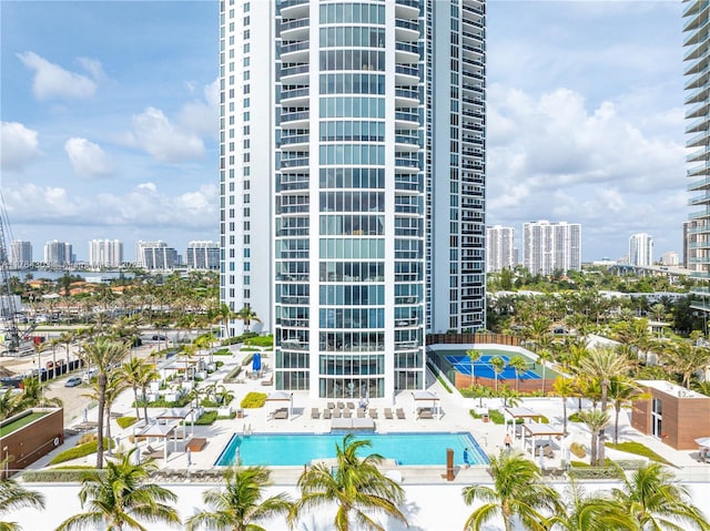 18911 Collins Ave Unit 405, Sunny Isles Beach, FL 33160 - view of building exterior featuring a view of skyline and a community pool