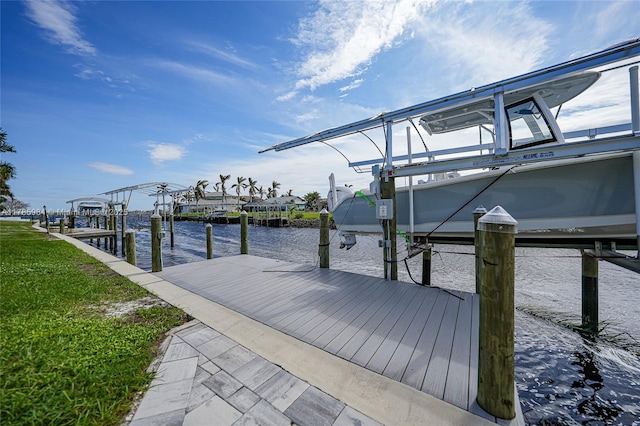 view of dock featuring boat lift and a water view