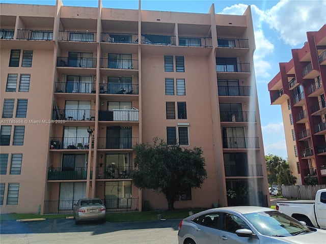 9688 Fontainebleau Blvd Unit 401, Miami, FL 33172 - view of building exterior featuring uncovered parking