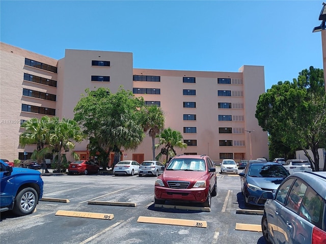 9688 Fontainebleau Blvd Unit 401, Miami, FL 33172 - view of building exterior with uncovered parking