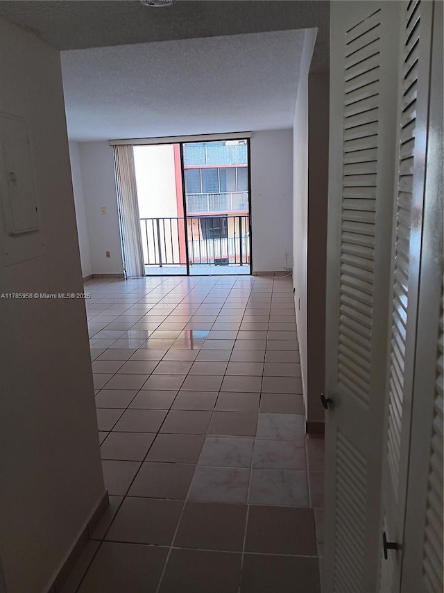 9688 Fontainebleau Blvd Unit 401, Miami, FL 33172 - tiled empty room with baseboards and electric panel