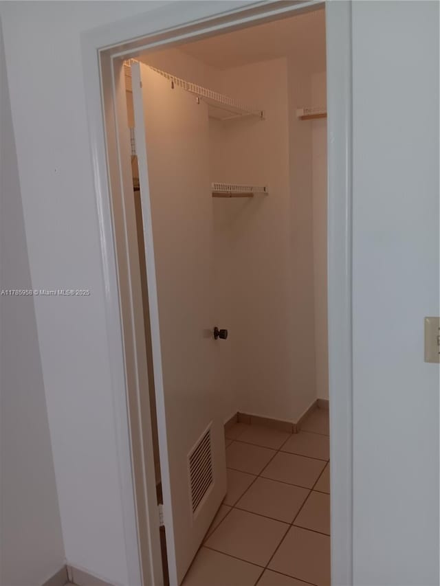 9688 Fontainebleau Blvd Unit 401, Miami, FL 33172 - bathroom featuring baseboards, visible vents, and tile patterned flooring