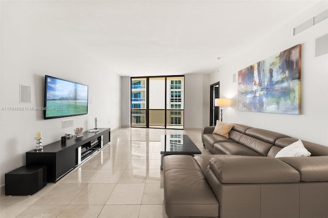 16275 Collins Ave Unit 2202, Sunny Isles Beach, FL 33160 - living room with floor to ceiling windows and light tile patterned flooring