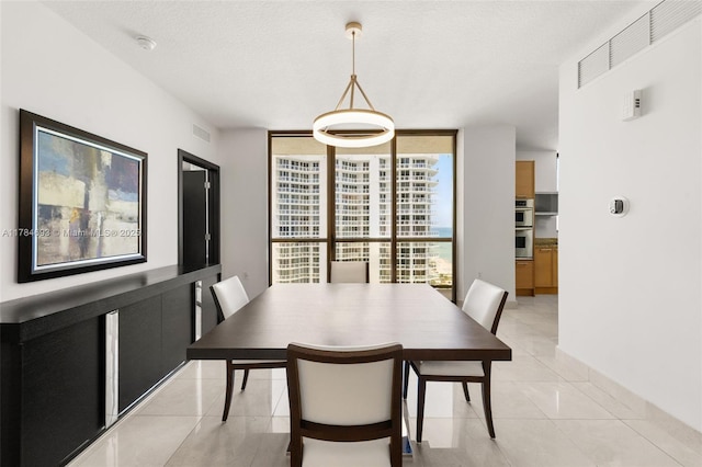 16275 Collins Ave Unit 2202, Sunny Isles Beach, FL 33160 - dining space featuring light tile patterned flooring and floor to ceiling windows