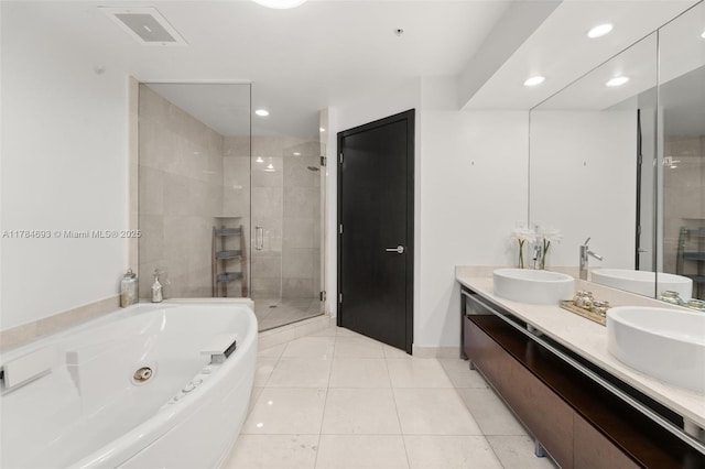 16275 Collins Ave Unit 2202, Sunny Isles Beach, FL 33160 - bathroom with a stall shower, double vanity, a tub with jets, recessed lighting, and tile patterned floors