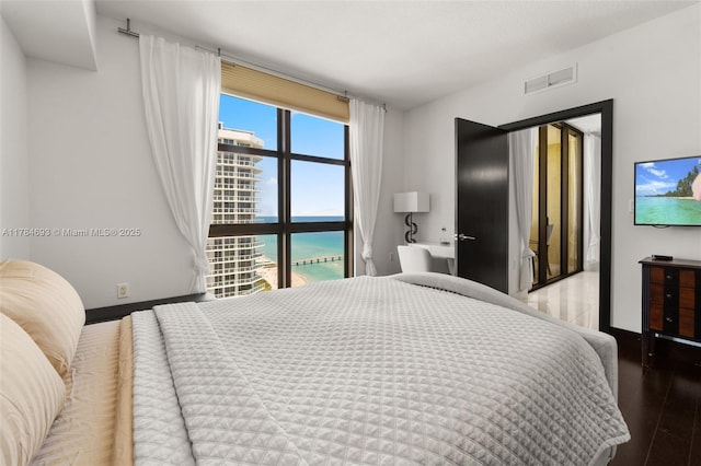 16275 Collins Ave Unit 2202, Sunny Isles Beach, FL 33160 - bedroom with wood finished floors and baseboards