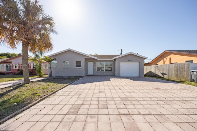 22188 SW 59th Ave, Boca Raton, FL 33428 - ranch-style house with a garage, stucco siding, decorative driveway, and fence