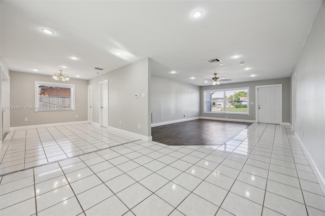 22188 SW 59th Ave, Boca Raton, FL 33428 - spare room with light tile patterned flooring, baseboards, recessed lighting, visible vents, and ceiling fan with notable chandelier