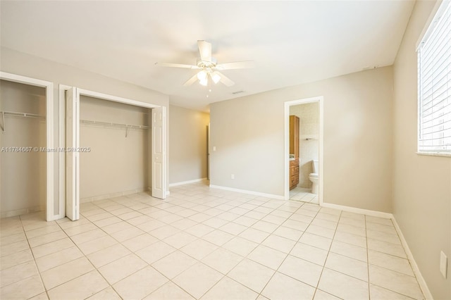 22188 SW 59th Ave, Boca Raton, FL 33428 - unfurnished bedroom featuring visible vents, a ceiling fan, light tile patterned flooring, baseboards, and two closets