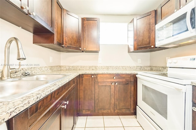 22188 SW 59th Ave, Boca Raton, FL 33428 - kitchen with white appliances, a sink, and light tile patterned floors