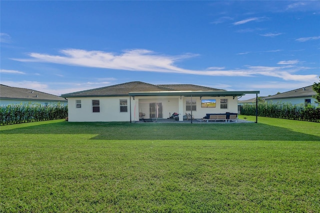 29074 SW 168th Ct, Homestead, FL 33030 - rear view of house featuring a yard, a patio, and stucco siding