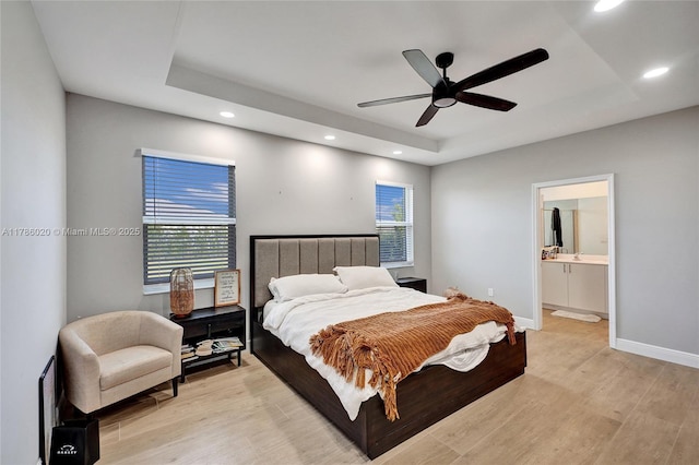 29074 SW 168th Ct, Homestead, FL 33030 - bedroom featuring light wood finished floors, a ceiling fan, a tray ceiling, and recessed lighting