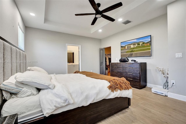 29074 SW 168th Ct, Homestead, FL 33030 - bedroom with a walk in closet, light wood-style flooring, baseboards, visible vents, and recessed lighting