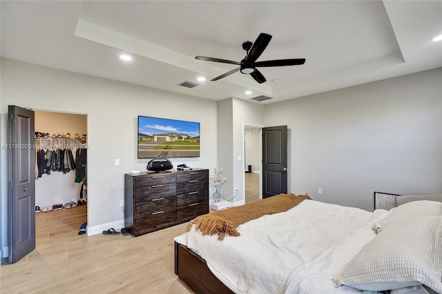 29074 SW 168th Ct, Homestead, FL 33030 - bedroom with a walk in closet, light wood-style flooring, baseboards, visible vents, and recessed lighting