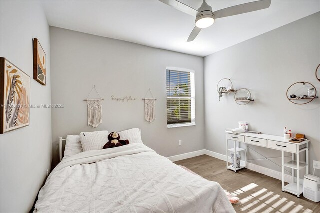 29074 SW 168th Ct, Homestead, FL 33030 - bedroom with light wood finished floors, baseboards, and ceiling fan