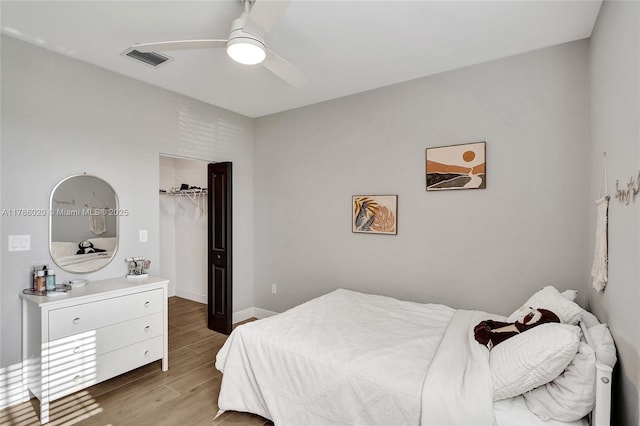 29074 SW 168th Ct, Homestead, FL 33030 - bedroom featuring a ceiling fan, a closet, a spacious closet, light wood-style floors, and visible vents