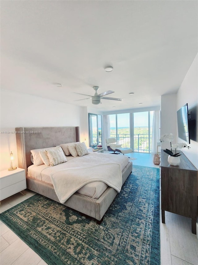bedroom featuring a ceiling fan and wood finished floors